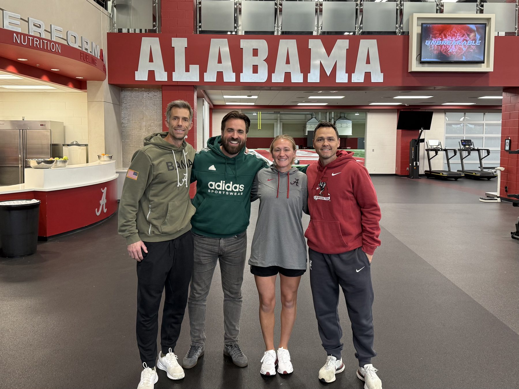 Louis Harrington with performance staff in a university performance centre